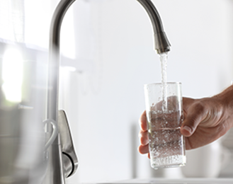 faucet with glass of water