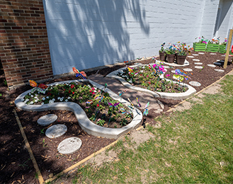 Garden patch with flowers and stones