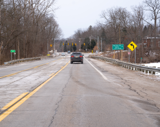 Photo of a bridge on west bound Grand River Avenue and the North Meridian Road intersection