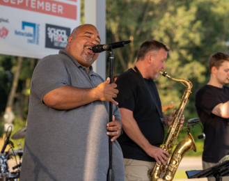 Photo of local band Global Village performing at the Marketplace on the Green Pavilion